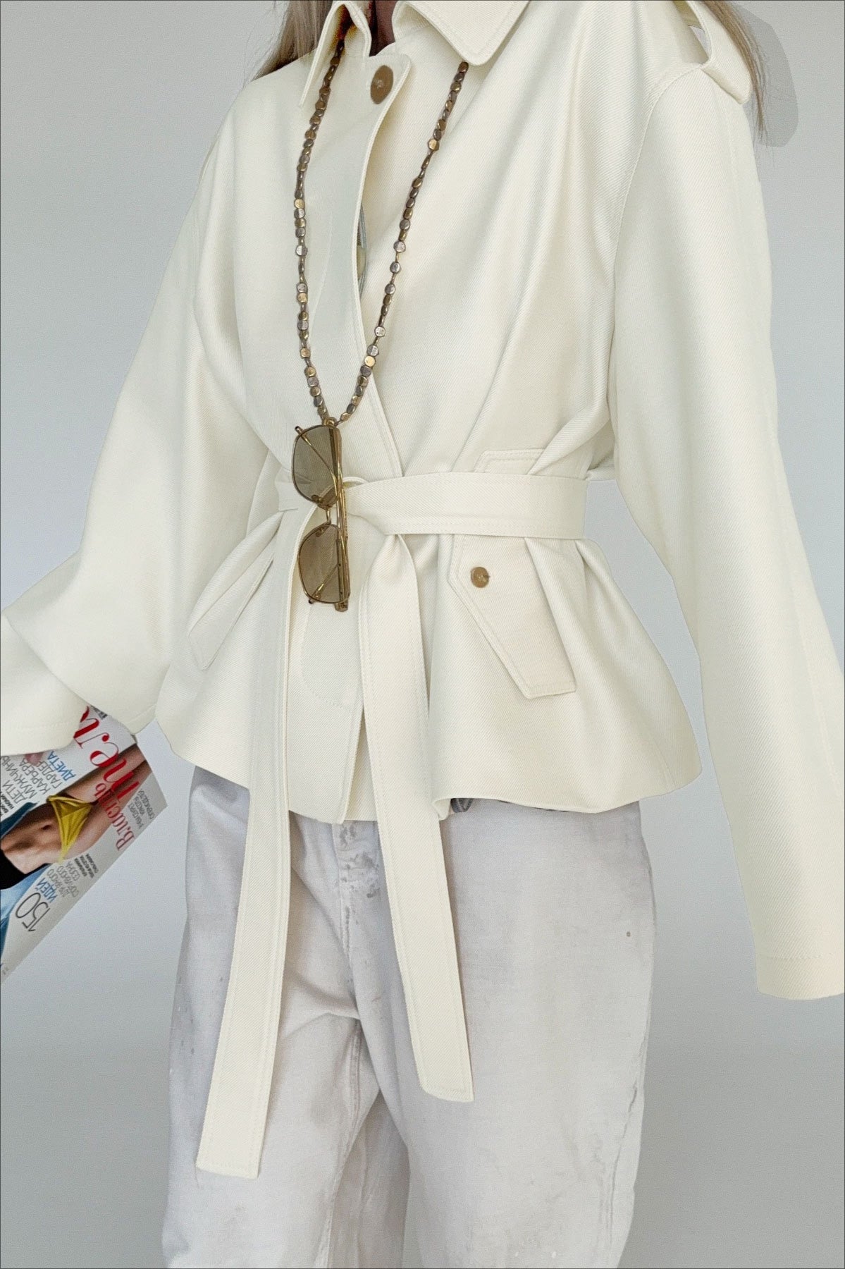 Lena White faux suede belted jacket shown from the side with a relaxed silhouette and adjustable waist tie