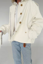 Lena White faux suede short jacket styled from the front with a self-tie waist, lapel collar, and long sleeves