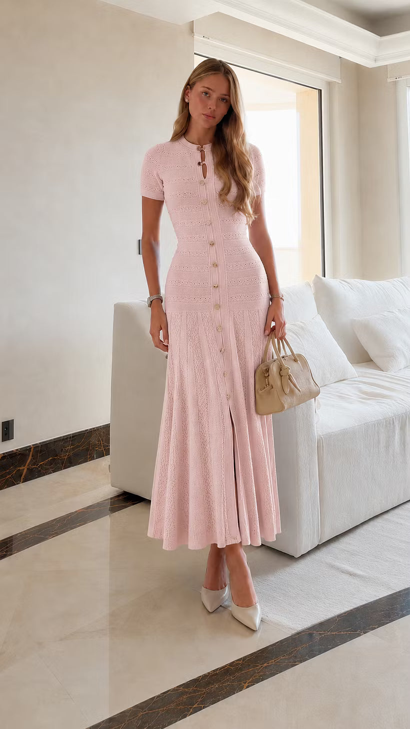 Leonie Pink button-front knit maxi dress styled full-body with a beige handbag.
