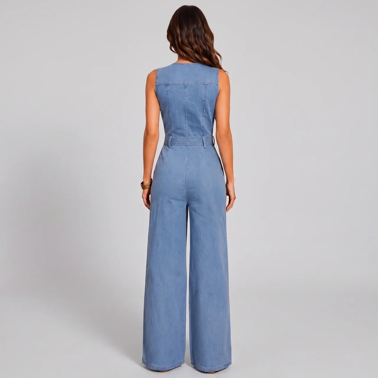 Back view of light blue denim jumpsuit with waist tie and wide leg pants by BELLA HUDSON