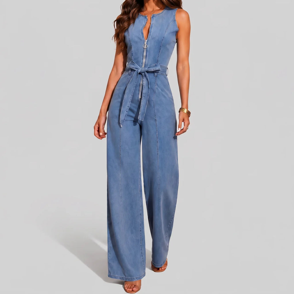 Front view of light blue denim jumpsuit with waist tie and wide leg pants by BELLA HUDSON
