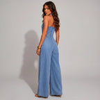 Side view of light blue denim jumpsuit with waist tie and wide leg pants by BELLA HUDSON