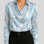 Light blue satin cowl neck blouse with floral print front view BELLA HUDSON