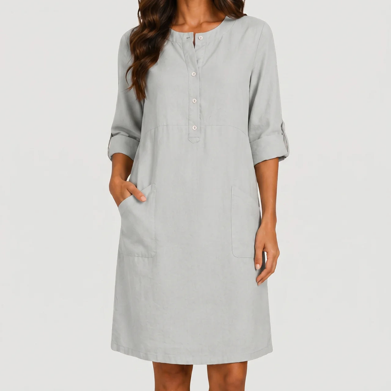 Front view of light gray linen midi dress with rolled sleeves and side pockets by BELLA HUDSON