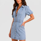 Front view of light wash denim mini dress with puff sleeves and waist belt by BELLA HUDSON