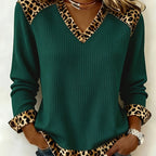 Lillian Green ribbed V-neck top with leopard-pattern trim at the neckline and cuffs, long sleeves, and a relaxed silhouette