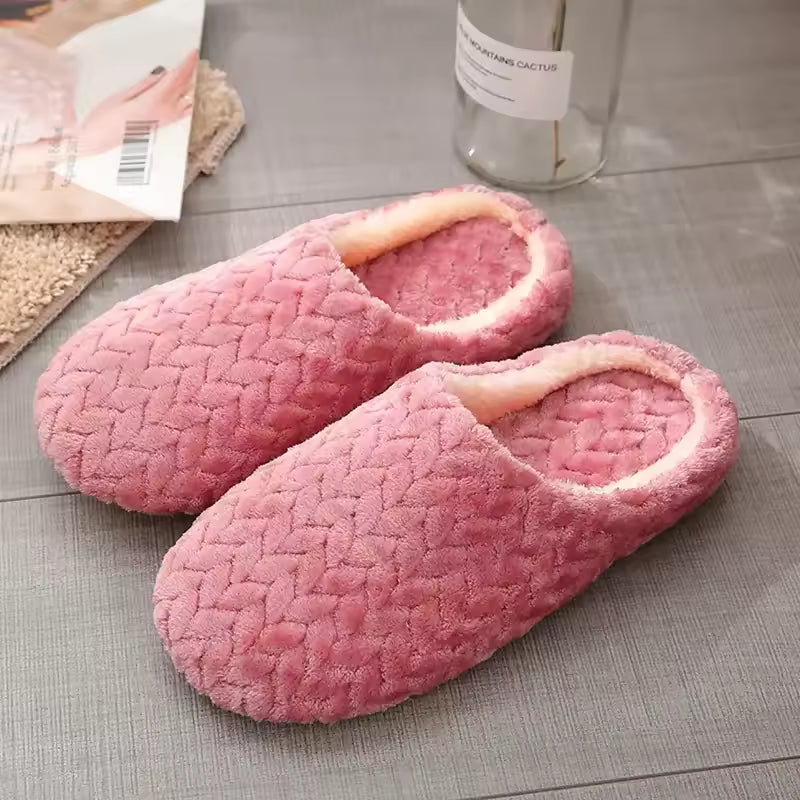 Lily Pink house slippers featuring a textured upper, plush lining, rounded toe, and low-profile sole