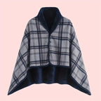 Linnea Black plaid buttoned wrap shawl with a structured shawl collar, front buttons, cape-style sleeves, and draped fit