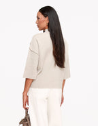 Linnea Taupe high neck knit top shown from the back with a straight hem and relaxed sleeves.