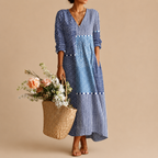 Liv Lightweight Polka-Dot Everyday Maxi Dress in blue featuring a V-neckline, long sleeves, patchwork polka-dot pattern, practical pockets, and a relaxed maxi-length silhouette. Designed by Bella Hudson.