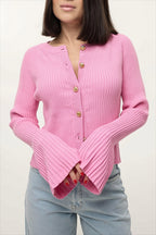 Luna Pink ribbed knit cardigan with button front and flared ribbed sleeves, worn with light wash jeans.