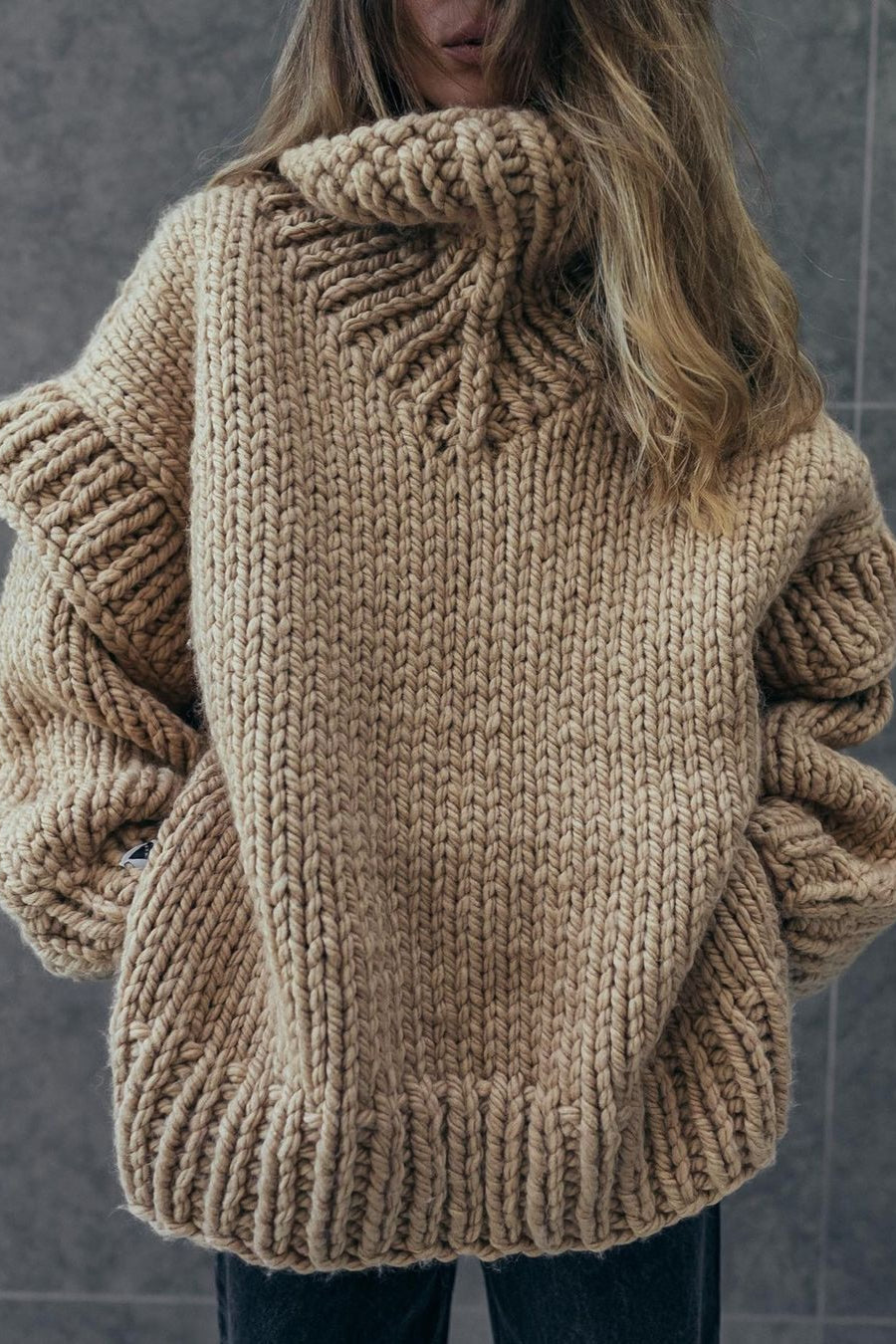 Lydia Beige chunky-knit turtleneck sweater showing the ribbed hem, cuffs and oversized fit.