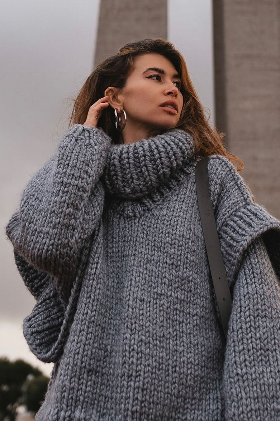 Lydia Gray chunky-knit turtleneck sweater close-up of the thick knit texture, high turtleneck and voluminous sleeves.