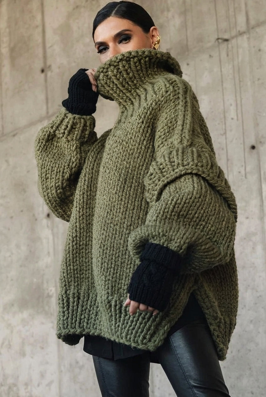 Lydia Green chunky-knit turtleneck sweater with a high folded turtleneck and voluminous sleeves.