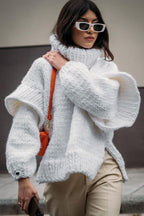 Lydia White chunky-knit turtleneck sweater featuring a high ribbed neckline, oversized shape, dropped shoulders, and long sleeves