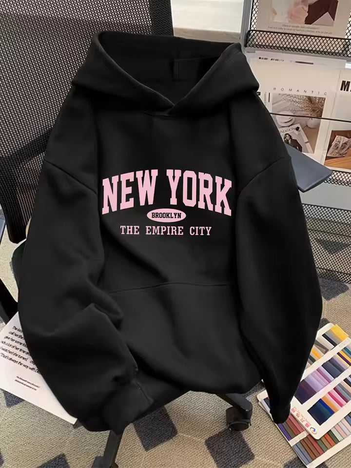 Madison Black graphic hoodie featuring New York lettering, kangaroo pocket, and ribbed hem