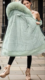Madison Green hooded winter parka featuring plush faux-fur trim, a long silhouette, front closure, and relaxed fit