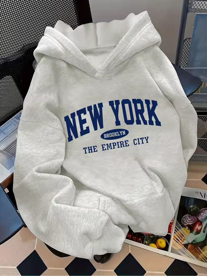 Madison White pullover hoodie with New York and Empire City graphic print, relaxed fit, and long sleeves