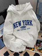 Madison White pullover hoodie with New York and Empire City graphic print, relaxed fit, and long sleeves