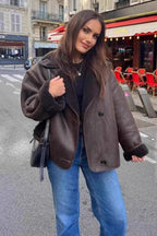 Maeve Brown faux leather jacket shown full length with a relaxed fit, plush-trim cuffs, wide lapels, and button-front design