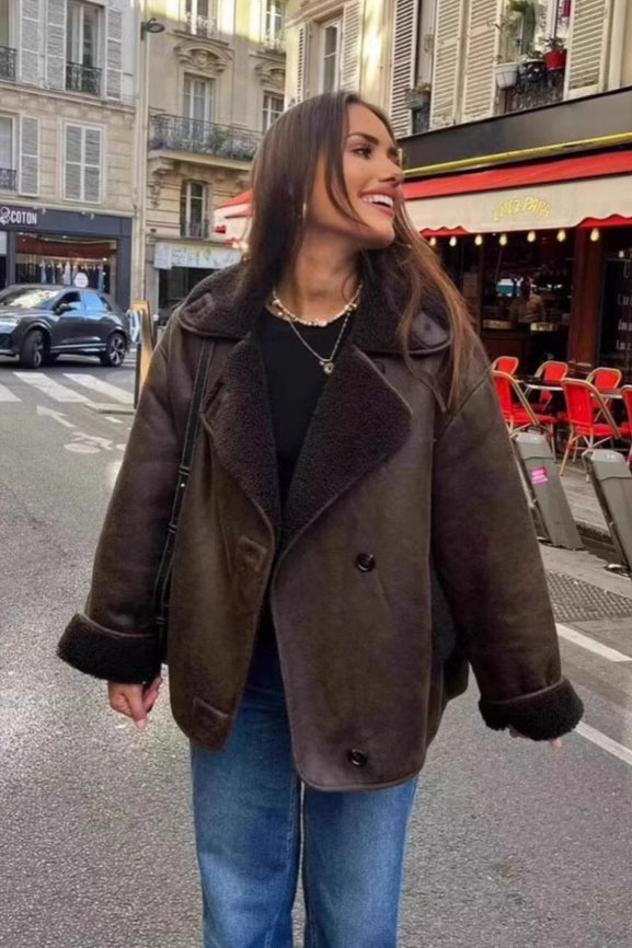 Maeve Brown faux leather jacket shown from the front with a roomy silhouette, plush contrast collar trim, and textured cuffs