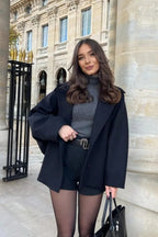 Mara Black double-breasted short jacket shown from the front with structured lapels and a relaxed tailored shape
