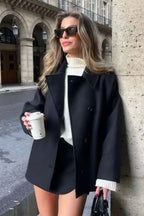Mara Black double-breasted short jacket with a relaxed fit, structured lapel collar, long sleeves, and button-front styling