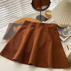 Mara Brown high-waist corduroy mini skirt displayed with knitwear and accessories