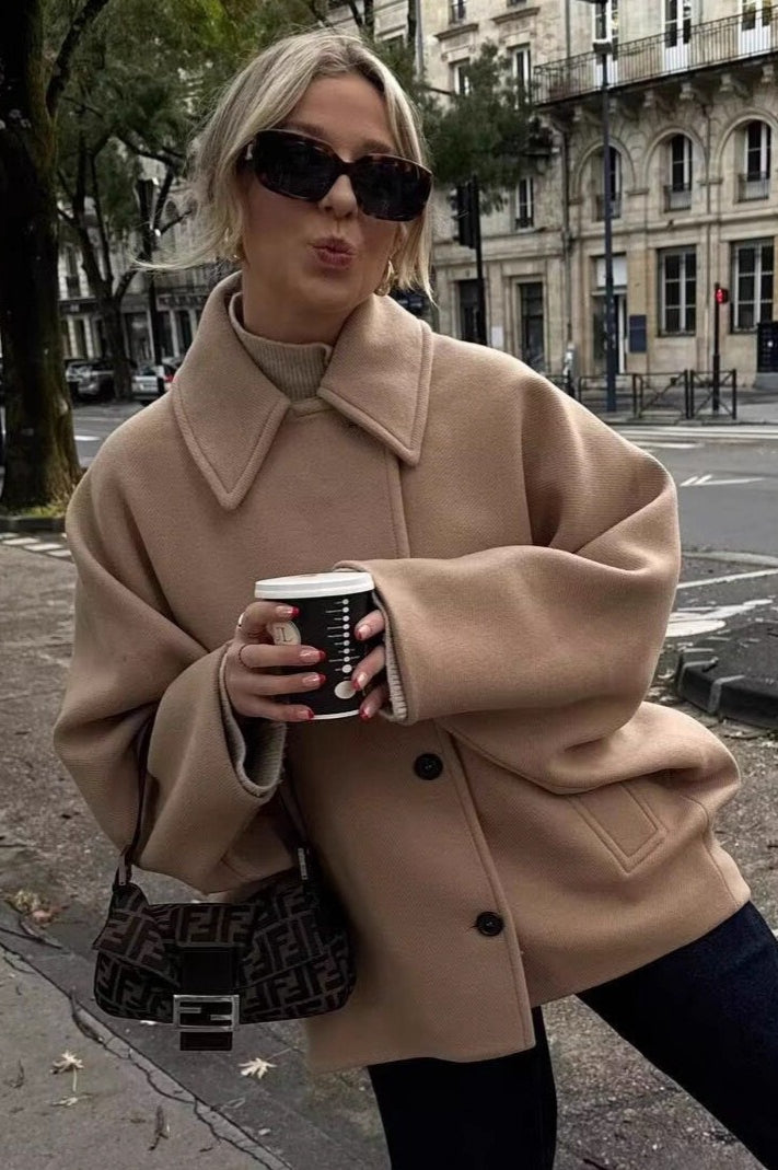 Mara Khaki short jacket shown from the front with a double-breasted design, relaxed silhouette, and structured lapels