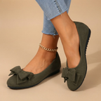 Marceline Ballet Flats Faux Suede Bow-Detail in Dark Green shown in front view, featuring a soft faux suede upper, delicate bow detail, classic round toe, cushioned insole, and elegant ballet flat silhouette, designed by Bella Hudson.