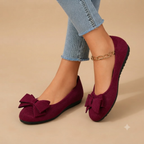 Marceline Ballet Flats Faux Suede Bow-Detail in Red shown in front view, featuring a soft faux suede upper, elegant bow detail, classic round toe, cushioned insole, and timeless ballet flat silhouette, designed by Bella Hudson.