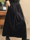 Maren Black corduroy maxi skirt with high waist, drawstring detail, and A-line silhouette
