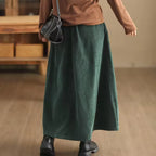 Maren Green corduroy maxi skirt with high waist and relaxed A-line shape