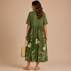 Back view of the Margot Floral-Print Lightweight Maxi Dress Boho in green, featuring a relaxed boho silhouette, lightweight fabric, floral print, and classic collar. Designed by Bella Hudson.