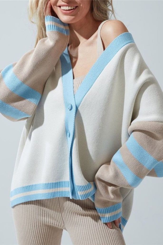 Marielle Blue color block cardigan with light blue V-neck trim and beige and blue striped sleeves, styled over a ribbed tank.