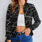 Front open view of the Marisol Jacket Bomber Geometric-Print in black, showcasing the geometric line print, zip-front design, long sleeves, and relaxed bomber fit. Designed by Bella Hudson.