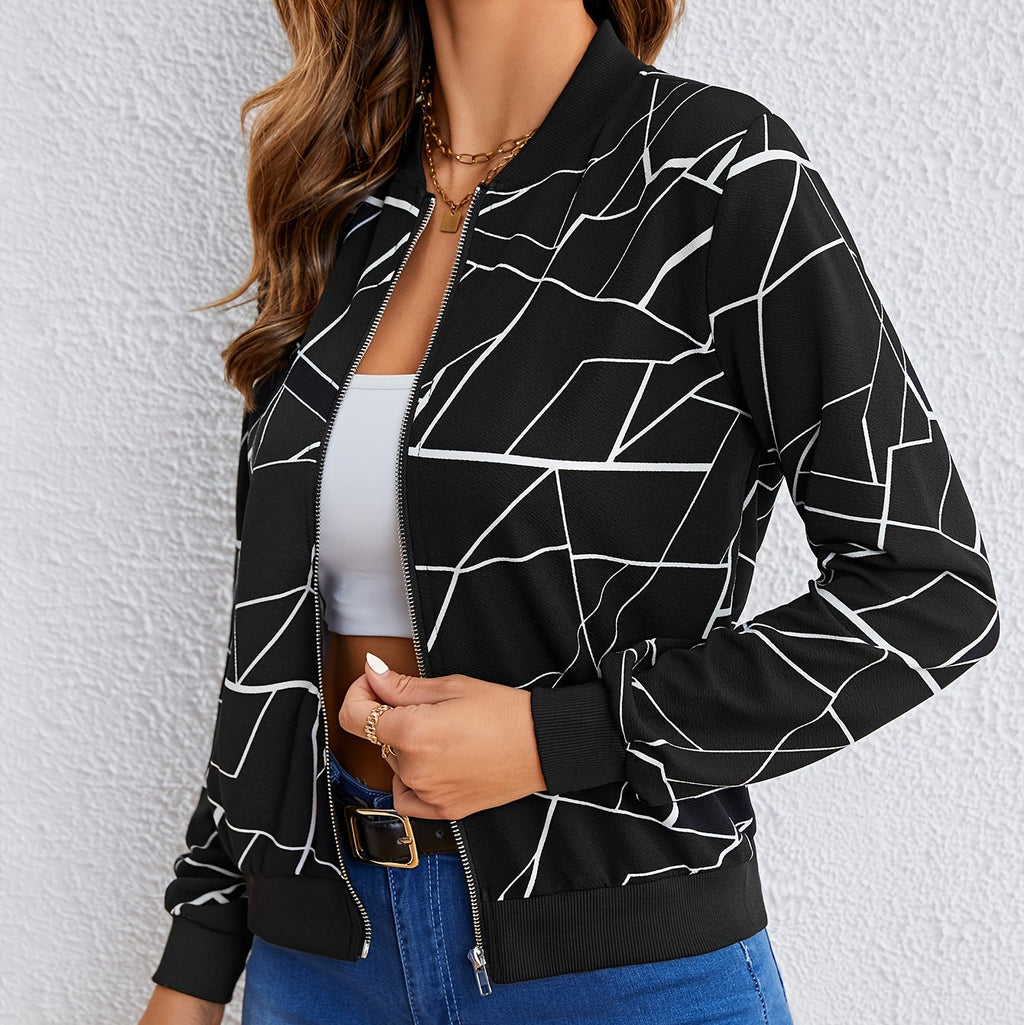 Lifestyle view of the Marisol Jacket Bomber Geometric-Print in black, featuring the bold geometric pattern, zip-front design, long sleeves, and casual bomber styling. Designed by Bella Hudson.
