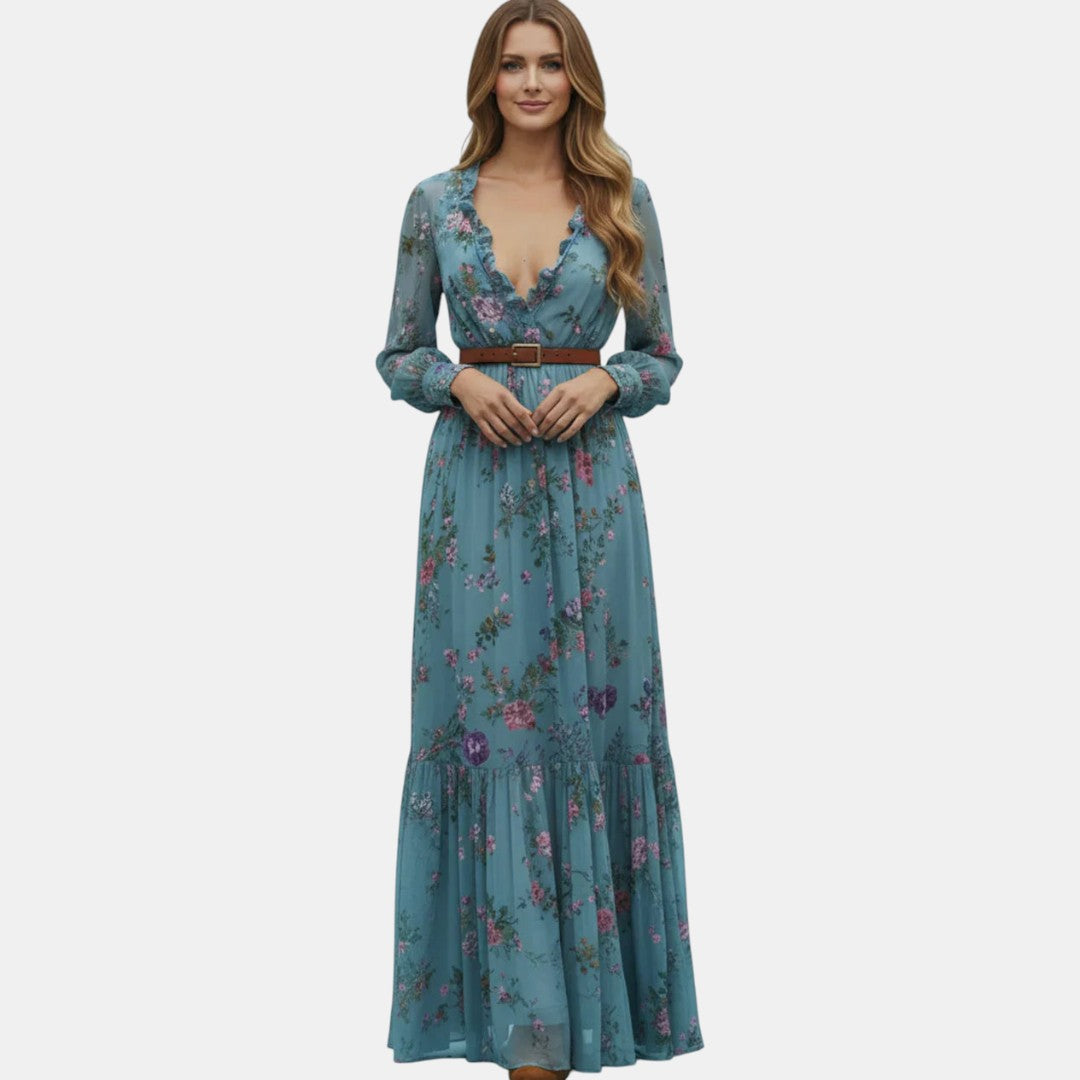 Front view of the Marlena Maxi Dress Floral-Embroidered Long-Sleeve Boho in blue, showcasing the bohemian floral print, braided waist belt, long sleeves, and elegant full-length silhouette. Designed by Bella Hudson.