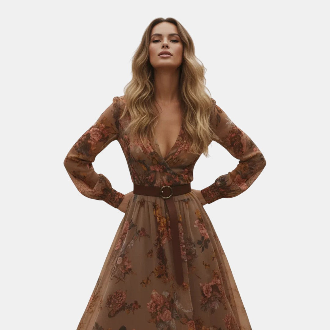 Walking view of the Marlena Maxi Dress Floral-Embroidered Long-Sleeve Boho in dark brown, showcasing the flowing maxi silhouette, embroidered floral details, and effortless bohemian elegance. Designed by Bella Hudson.