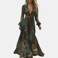 Flowing view of the Marlena Maxi Dress Floral-Embroidered Long-Sleeve Boho in green, showcasing the graceful movement of the maxi skirt, embroidered floral details, and relaxed bohemian silhouette. Designed by Bella Hudson.