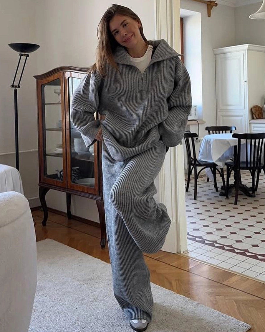 Maya Gray ribbed knit lounge set shown indoors with a relaxed half-zip collared sweater and matching wide-leg pants