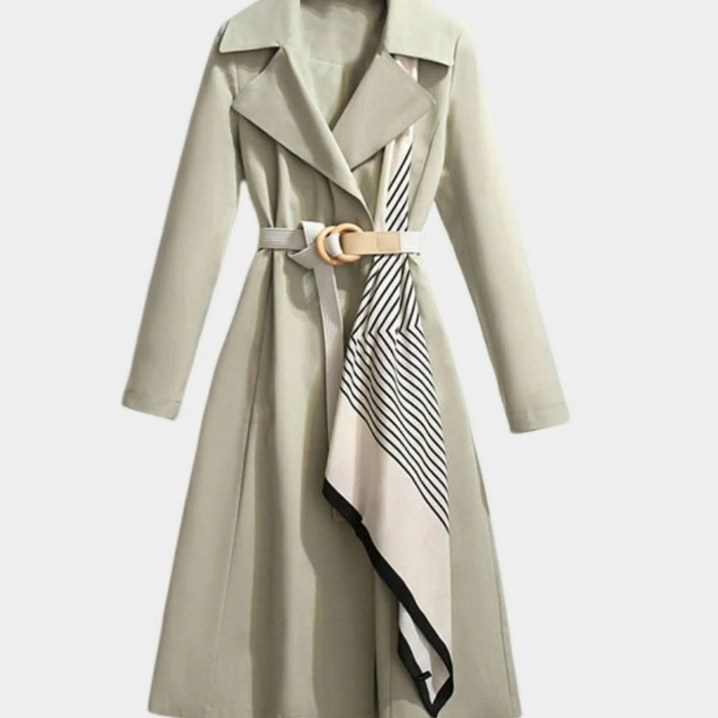 Maya Green midi trench coat featuring a notched lapel collar, adjustable waist belt, decorative patterned scarf, and long sleeves