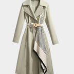 Maya Green midi trench coat featuring a notched lapel collar, adjustable waist belt, decorative patterned scarf, and long sleeves