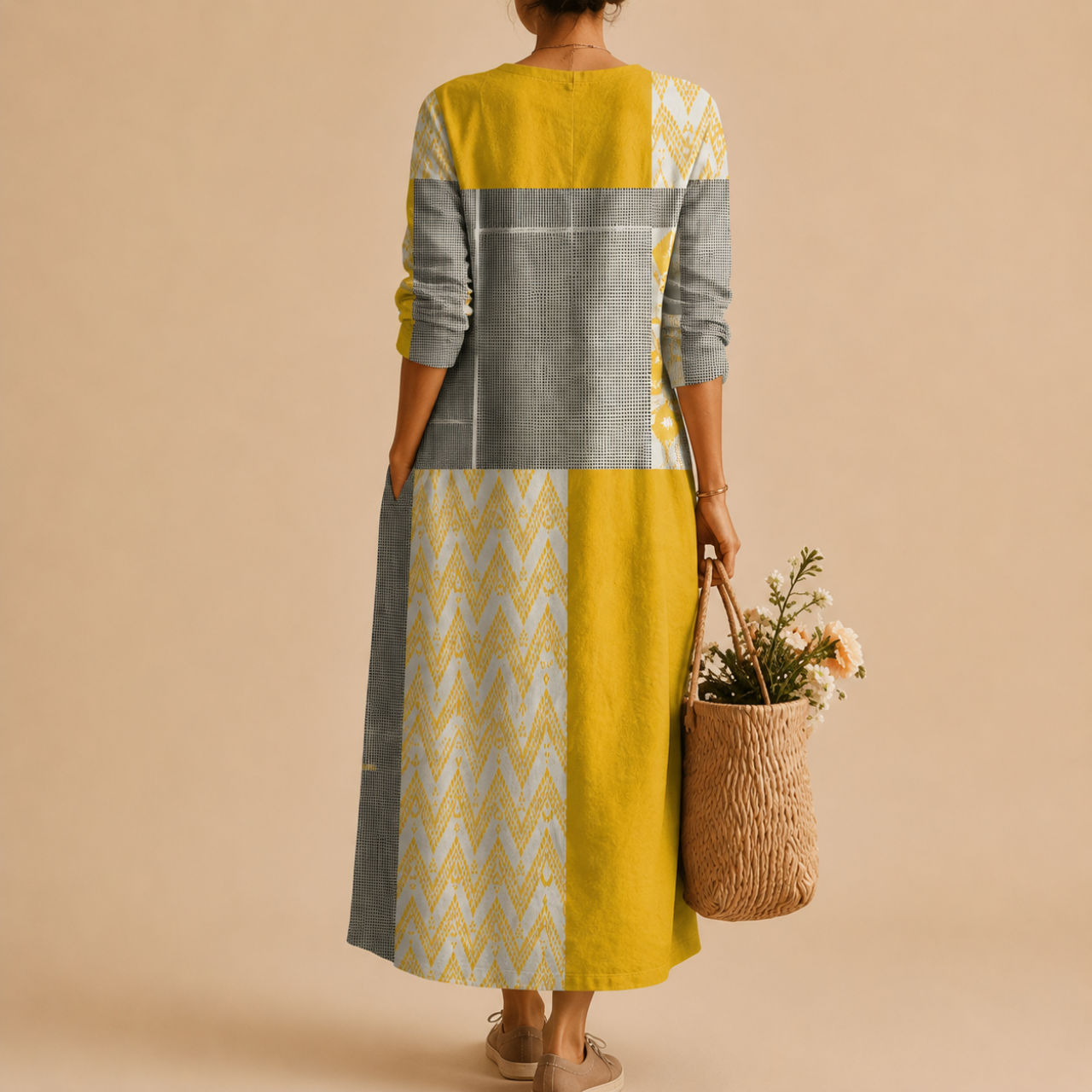 Maya Lightweight Patchwork Polka-Dot Midi Dress, back view featuring the flowing silhouette and modern patchwork design. Designed by Bella Hudson.