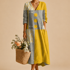 Close-up of the Maya Lightweight Patchwork Polka-Dot Midi Dress showcasing the patchwork print, decorative button details, and lightweight fabric. Designed by Bella Hudson.
