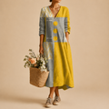 Maya Lightweight Patchwork Polka-Dot Midi Dress, front view highlighting the vibrant patchwork pattern, decorative buttons, and relaxed fit. Designed by Bella Hudson.