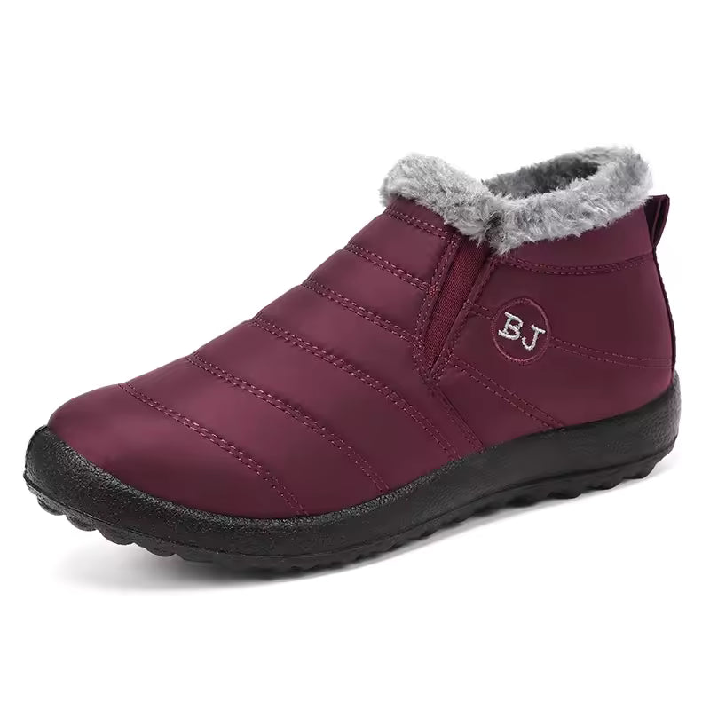 Maya quilted ankle snow boots with plush collar and decorative side emblem