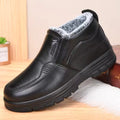 Mia Black plush-lined ankle boots with elastic gussets and thick textured outsole, shown from the side