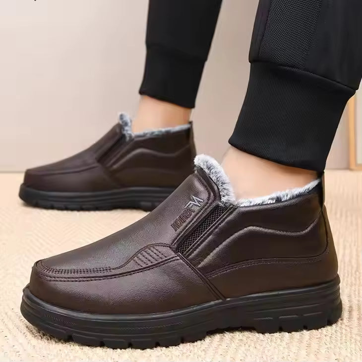 Mia Brown slip-on ankle boots with plush lining and elastic side panels, shown on feet