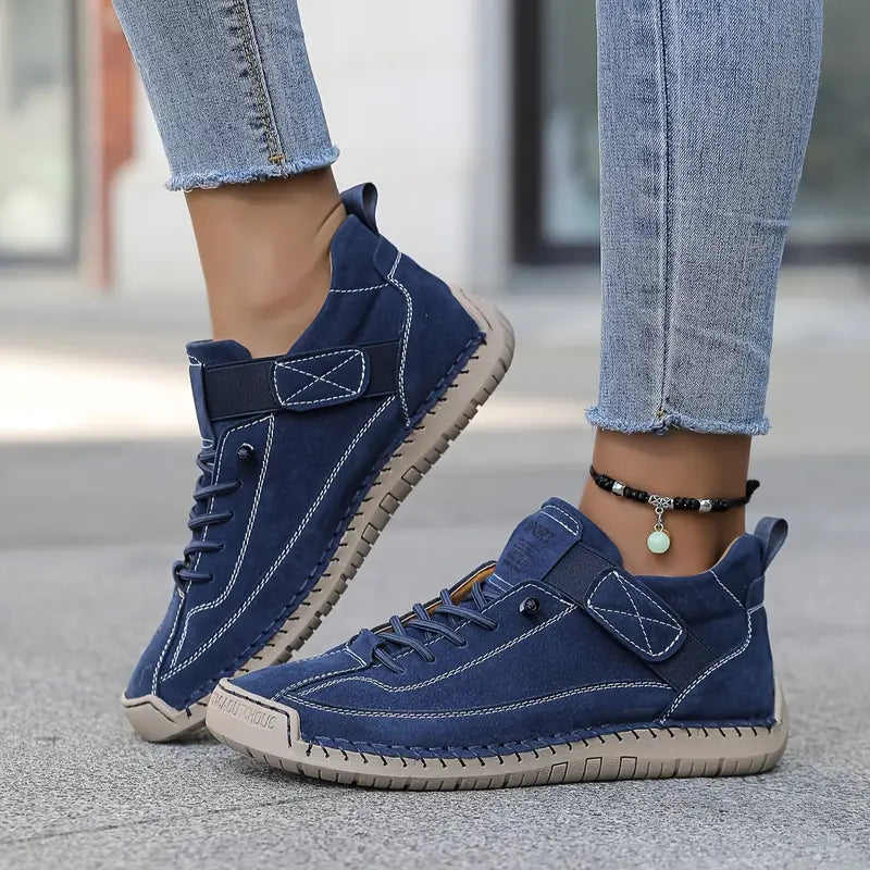Side view of Blue Mia Supportive Lightweight Cushioned Sneakers by BELLA HUDSON
